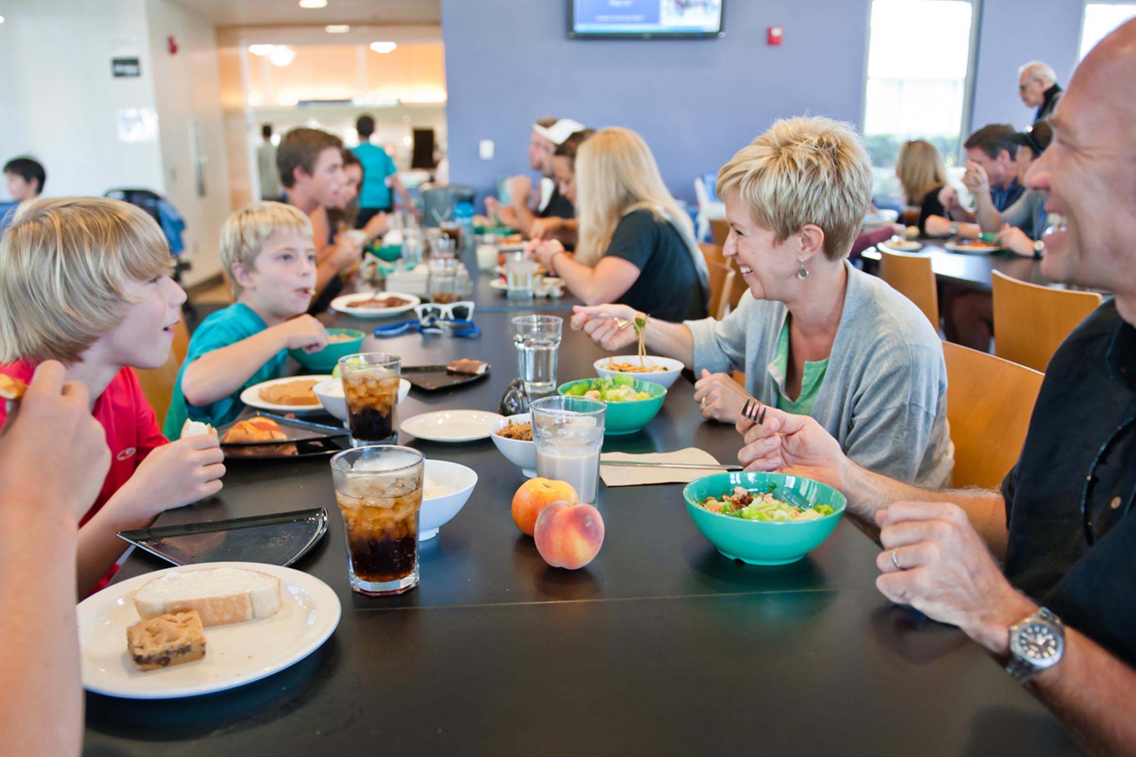 Family eating a meal together in the dining commons.